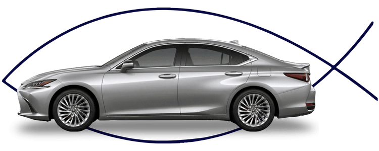 Blue car-shaped keychains displayed on the front desk, with a BMW mug and a Christian fish symbol sign in the background.