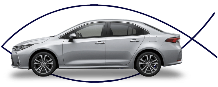 Blue car-shaped keychains displayed on the front desk, with a BMW mug and a Christian fish symbol sign in the background.