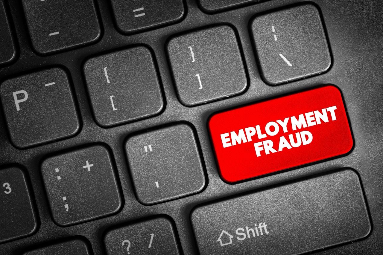 Employment fraud written on the enter key on a black keyboard