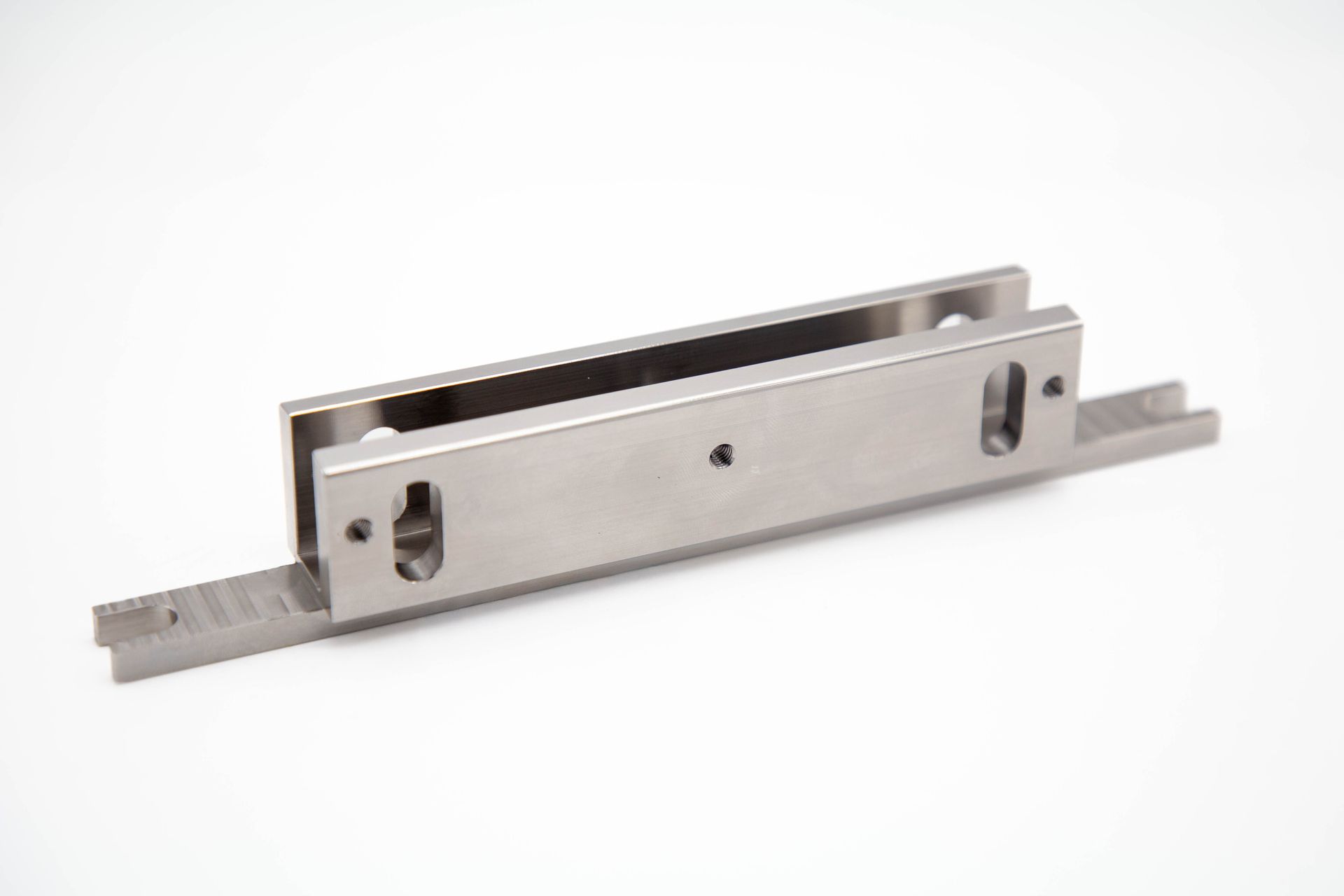 Metal drawer slide with two horizontal pieces connected by a vertical piece.