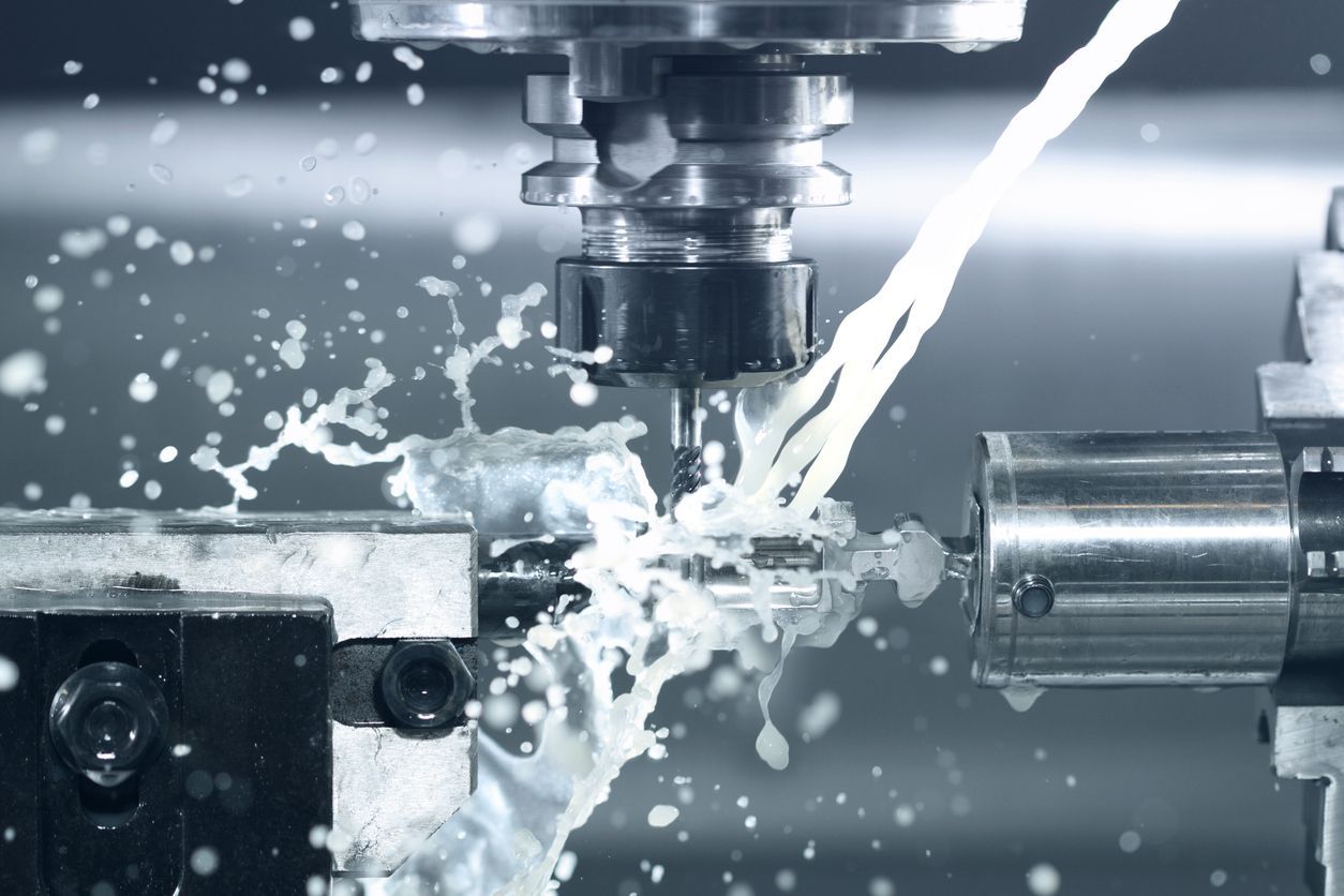CNC machine cutting metal, spraying coolant.
