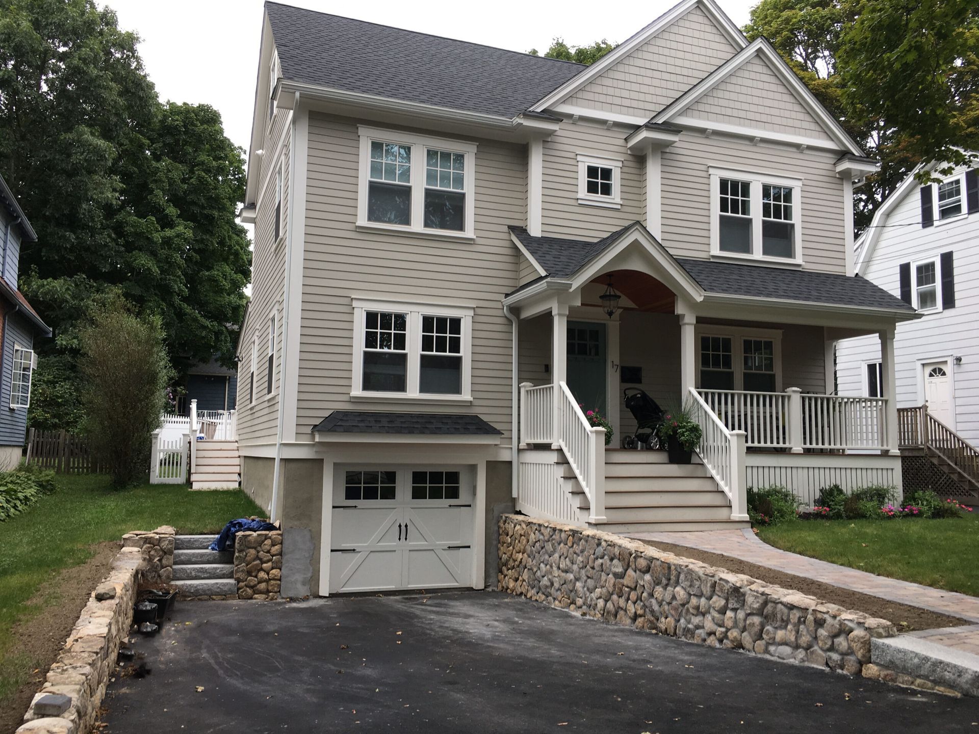 A large house with a garage and stairs