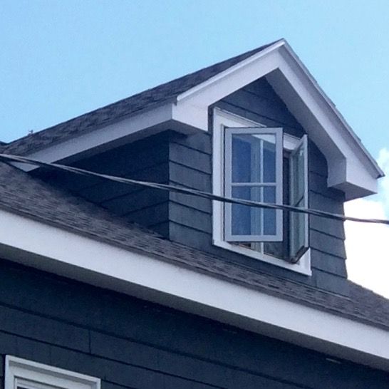A house with a window on the top of it