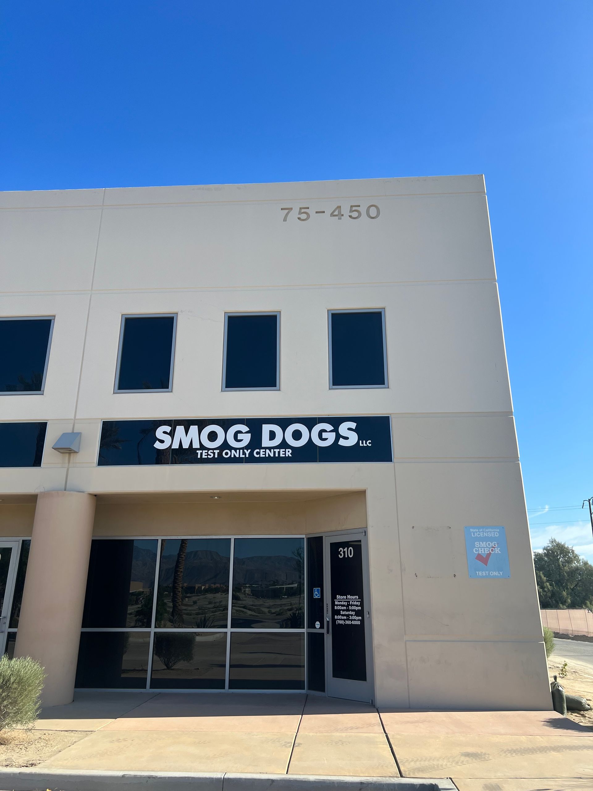 A building with a sign that says smog dogs