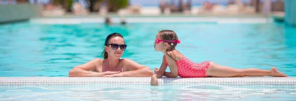 Mum and daughter by the pool Bundaberg