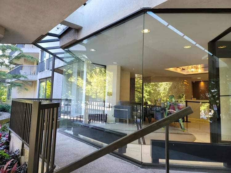 A building with a lot of windows and stairs leading up to it