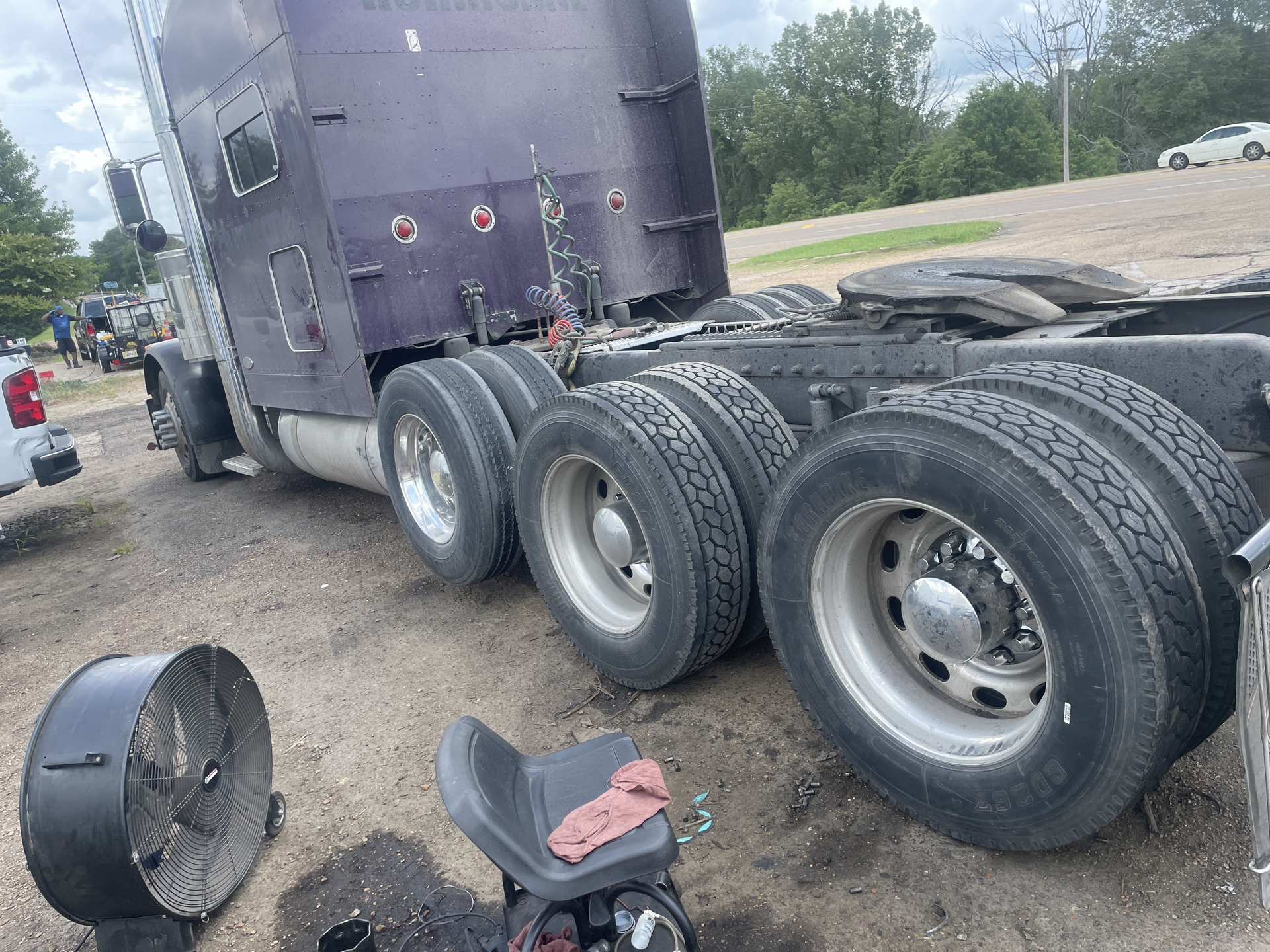 A car is sitting on top of a tow truck.