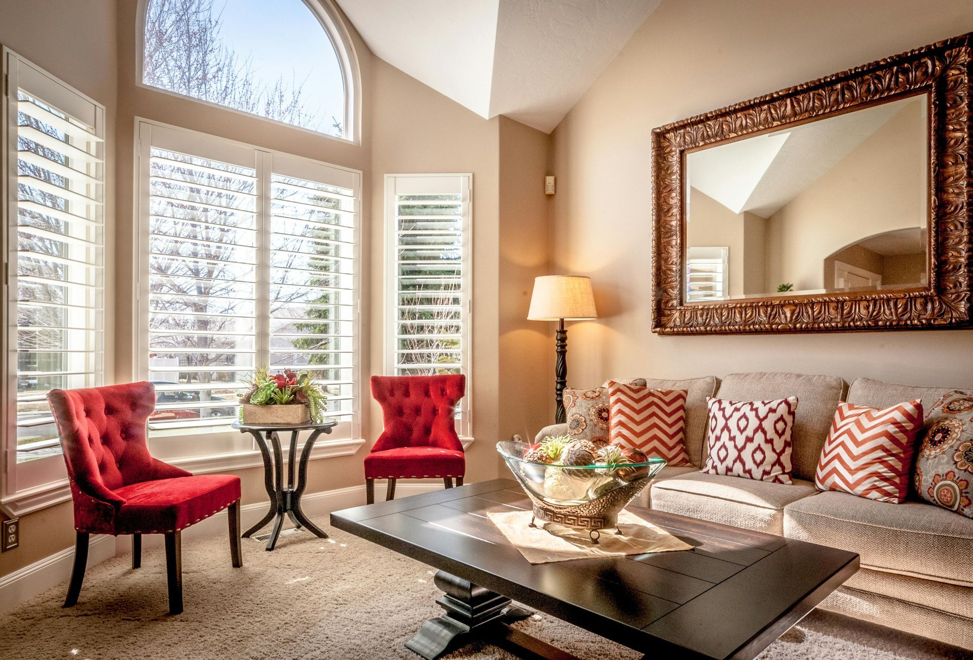 A yellow wet floor sign and a janitorial cleaning cart in a bright, modern office hallway.