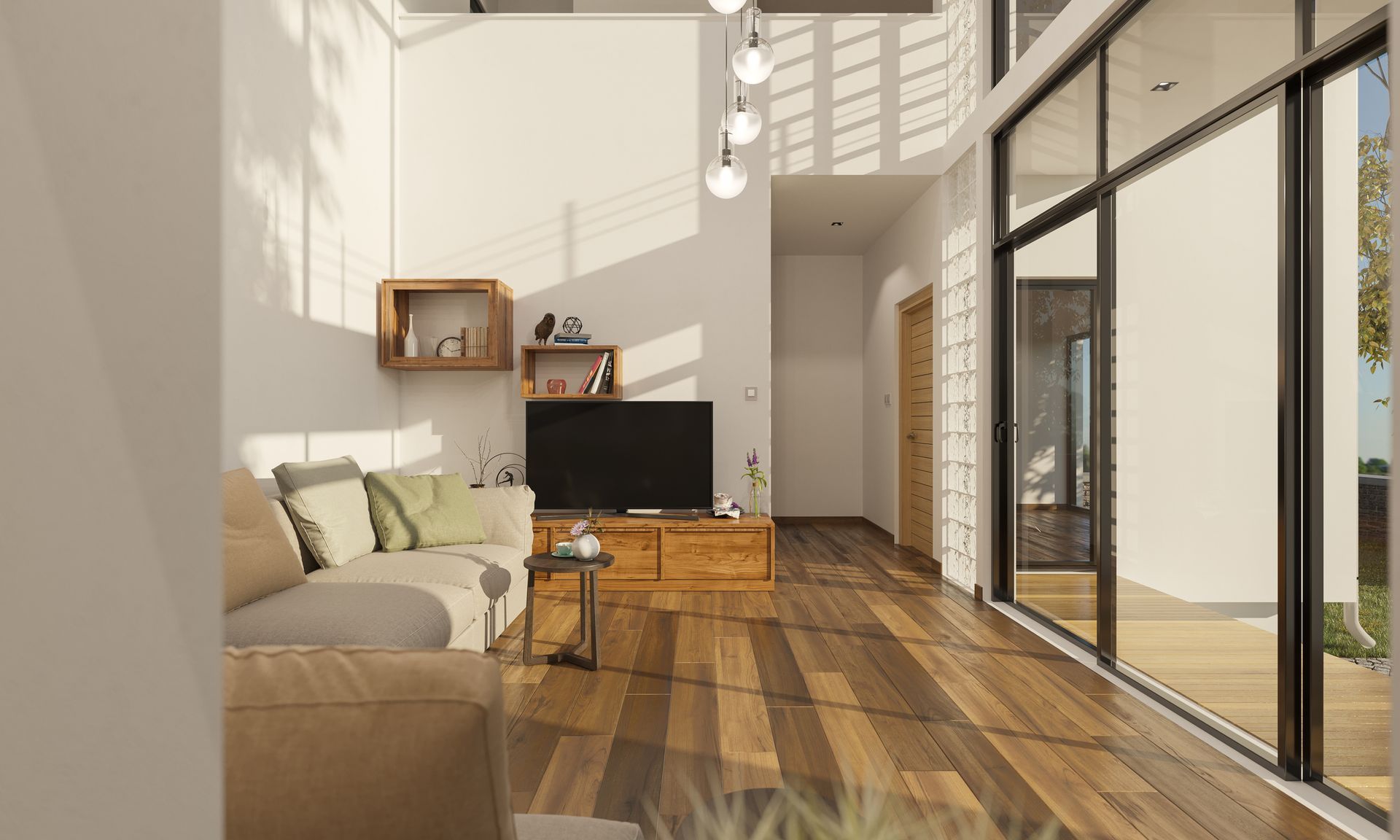 A living room with a couch , television , and hardwood floors.