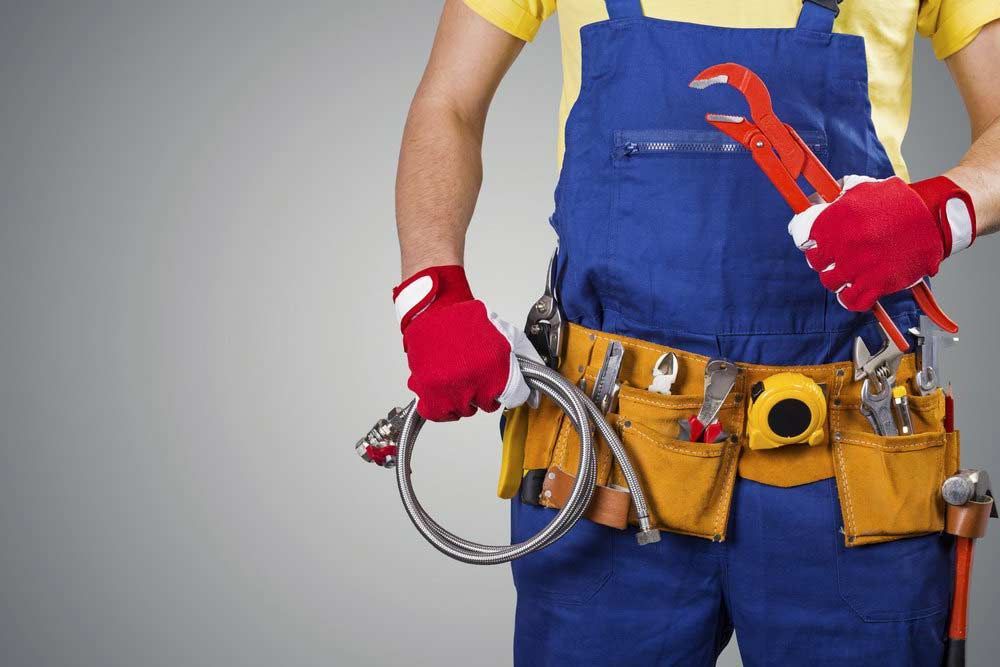 Plumber With A Yellow Tool Belt