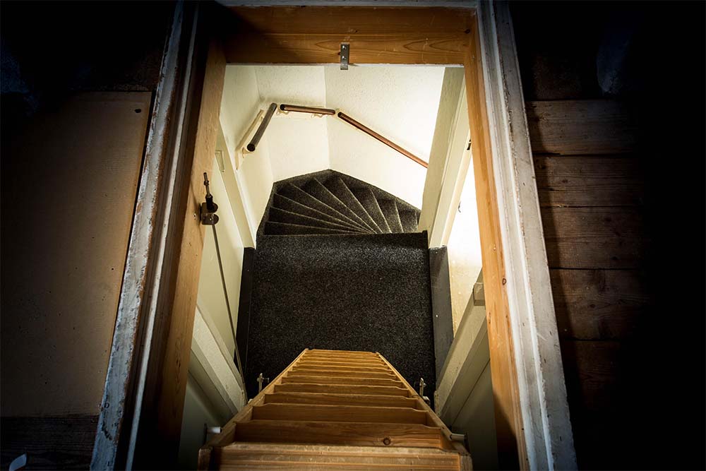 Attic Ladder Installed Over A Stairwell