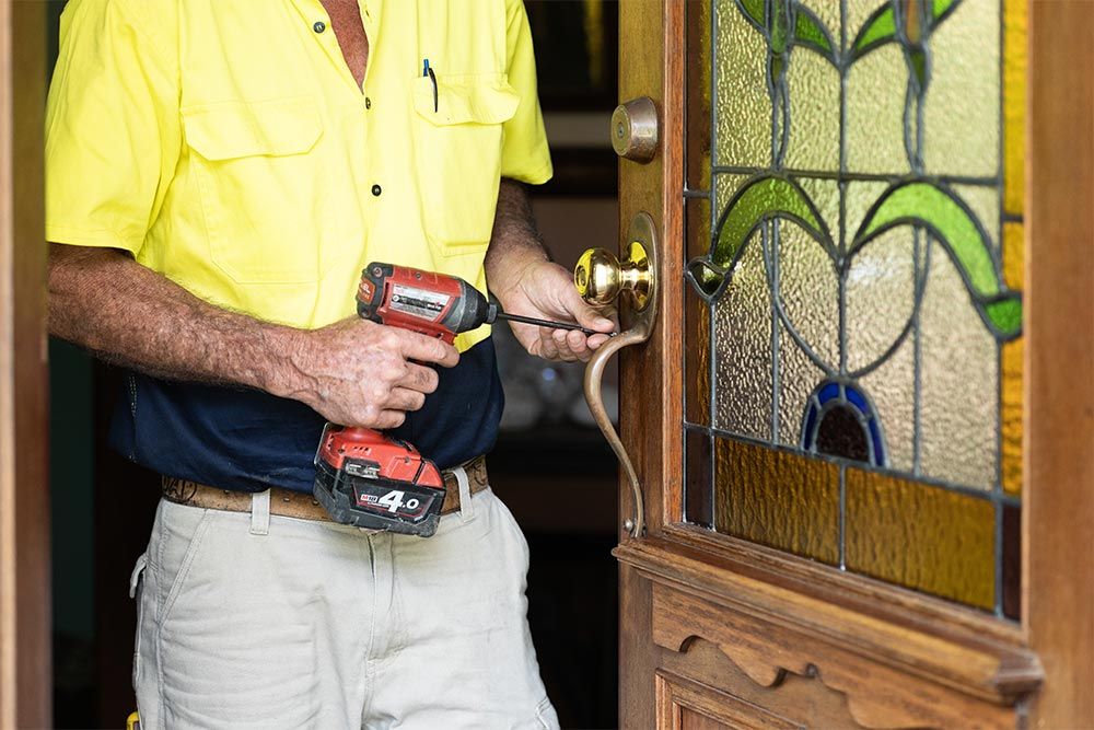 Sunshine Coast Handyman Repairing A Door