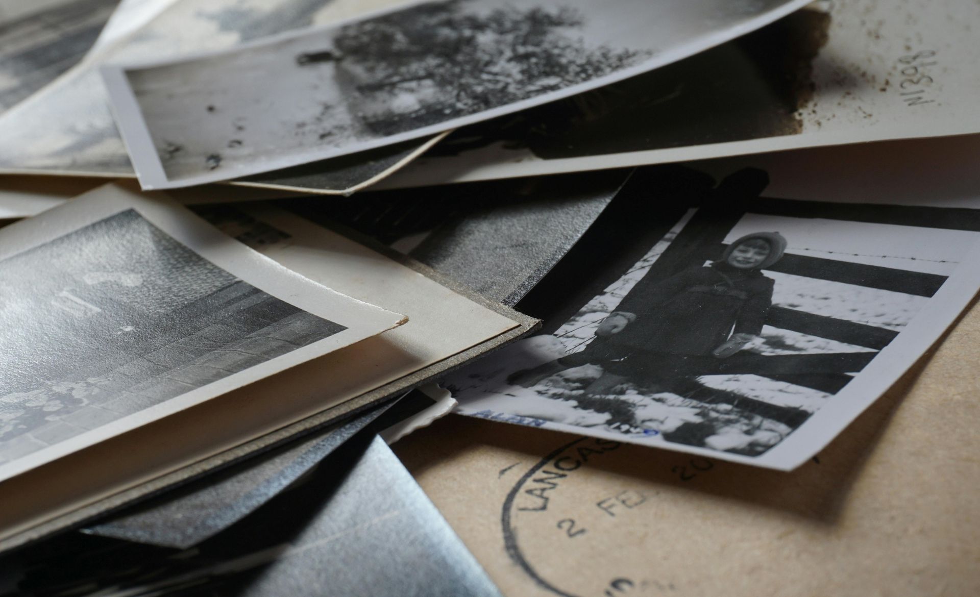 stack of old black and white photographs