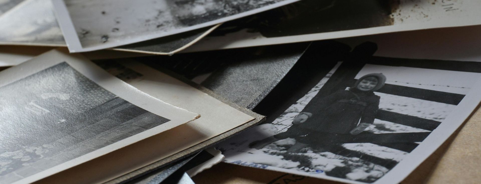 Stack of old black and white photographs