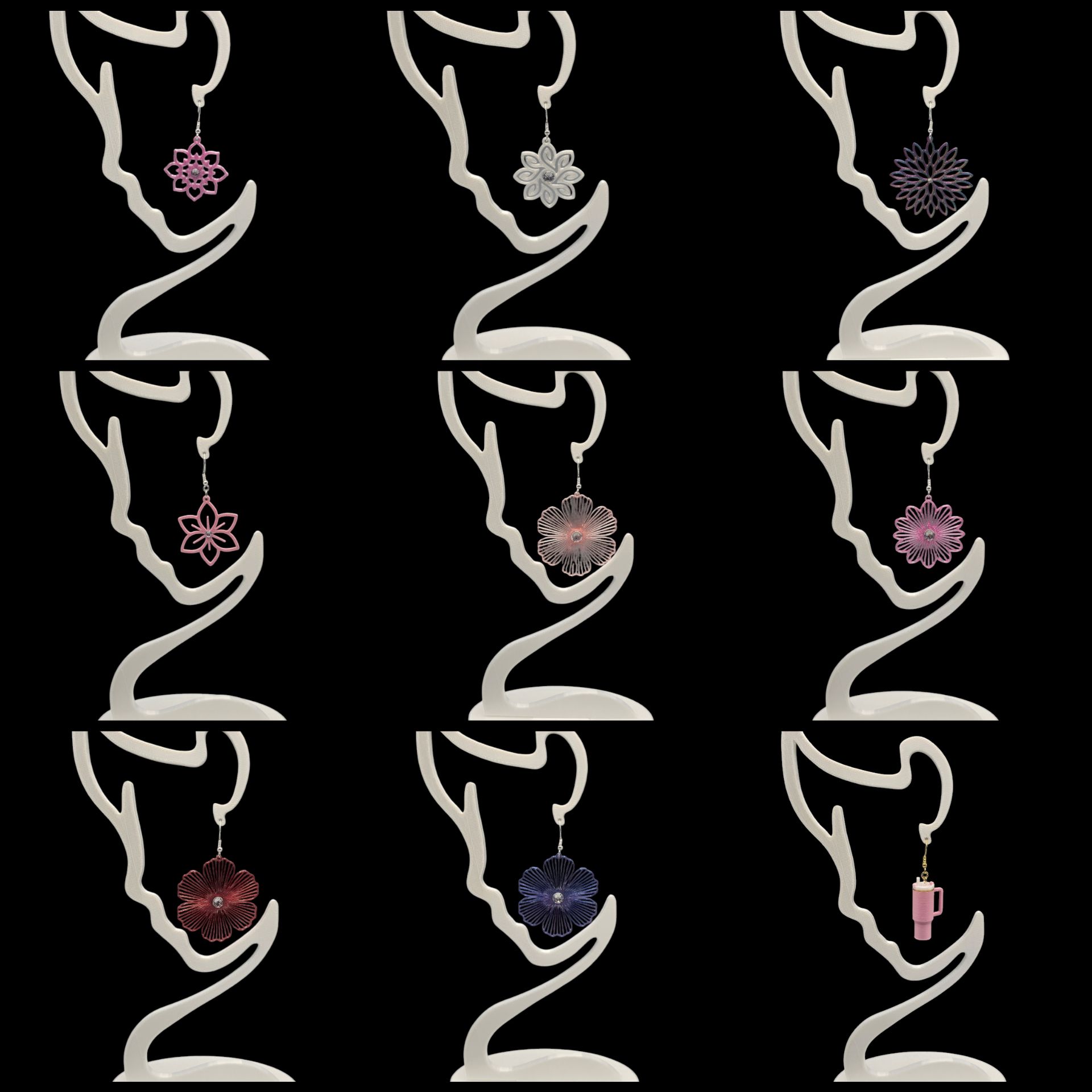 Negen paar sierlijke oorbellen op displaystandaards, elk in een andere kleur en ontwerp, op een zwarte achtergrond.