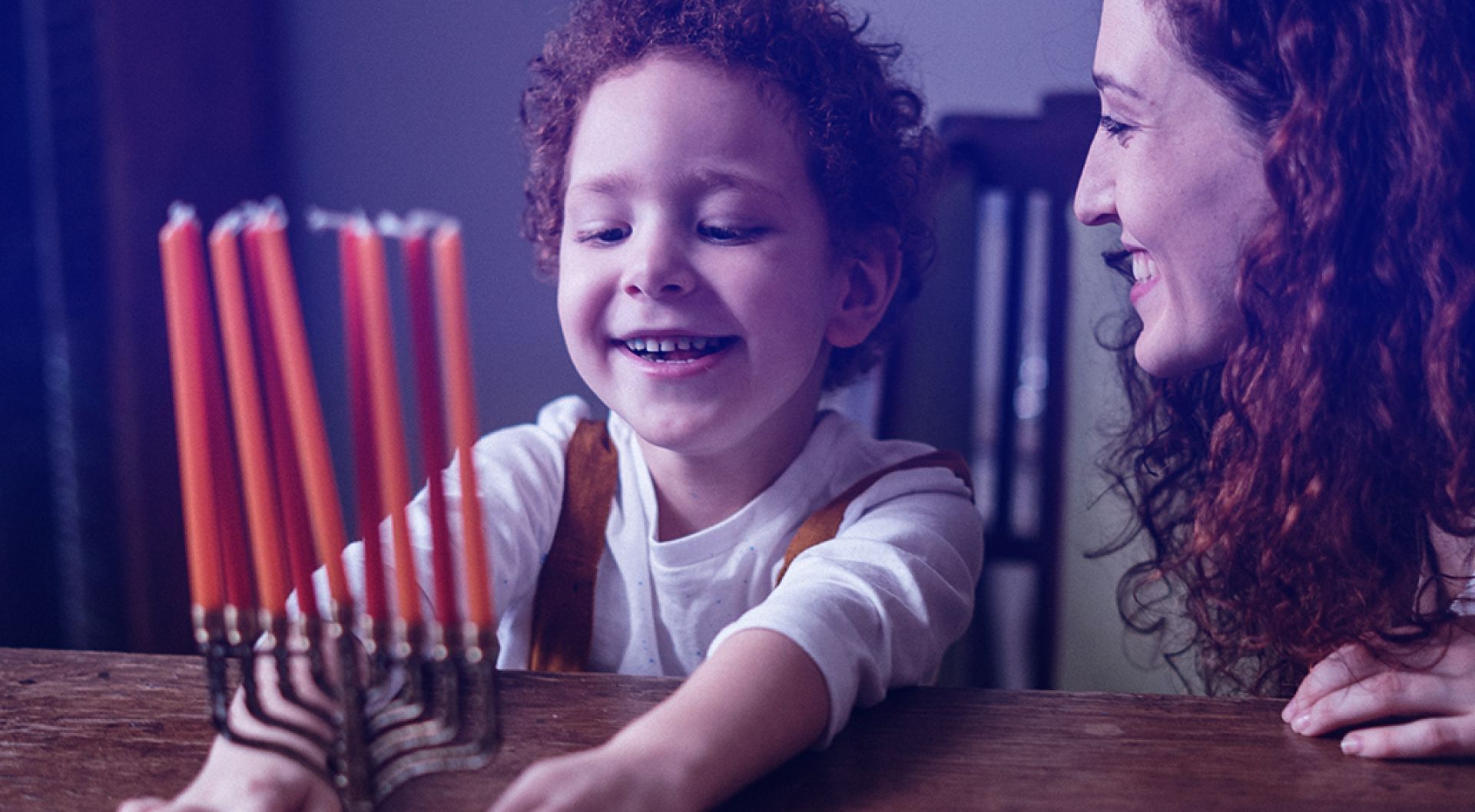 A child getting candles ready to light