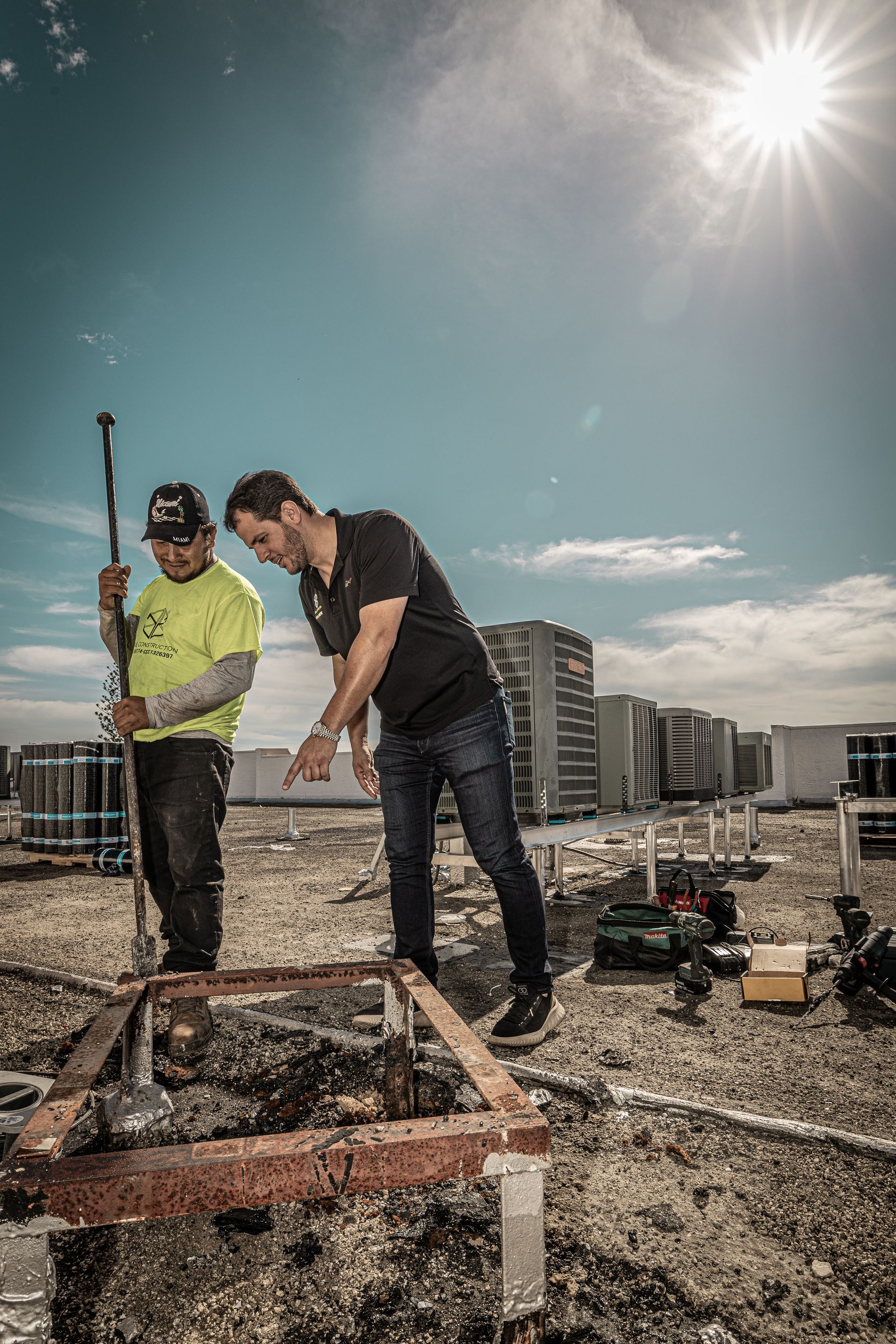 Two men are working on a construction site.