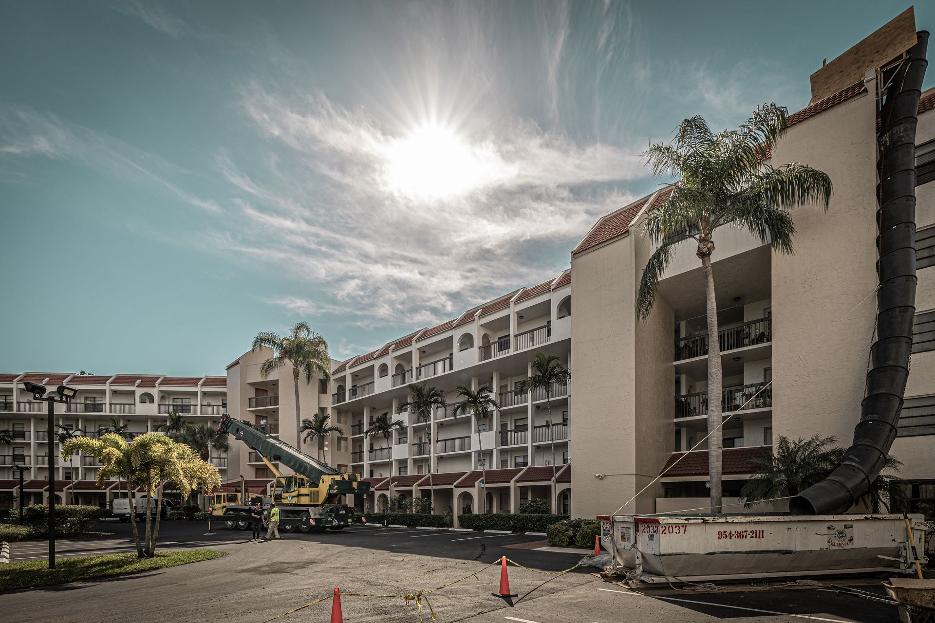 A large building with palm trees in front of it