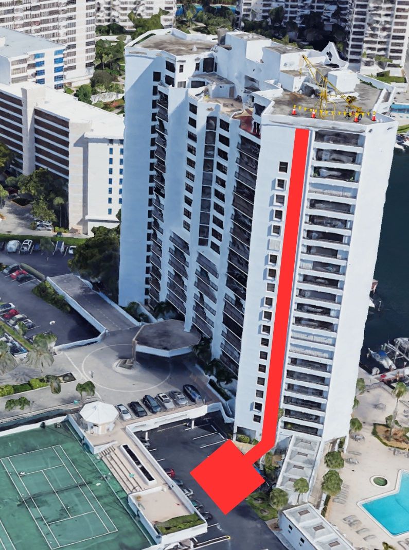 A group of people are working on the roof of a building.