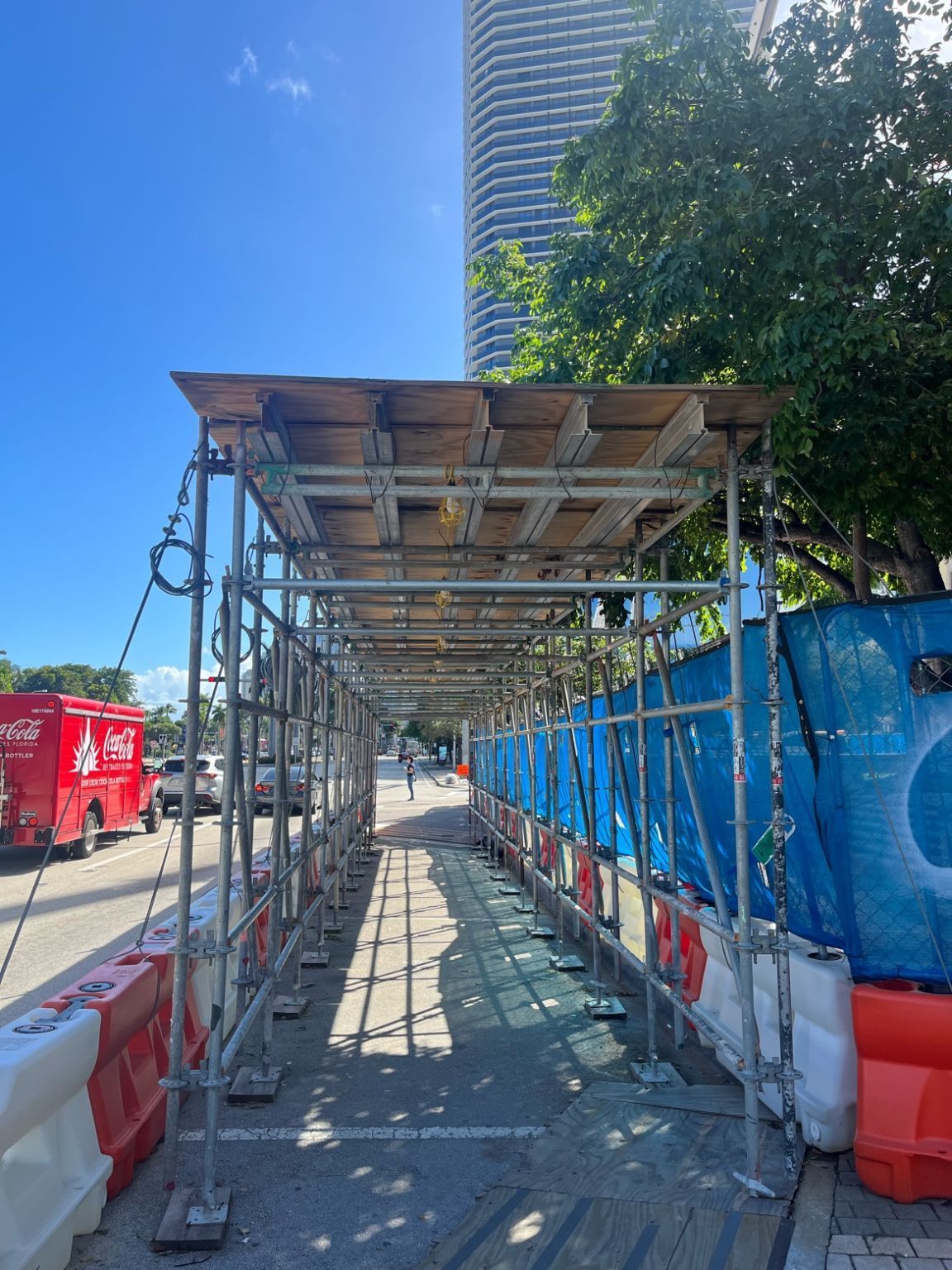 A group of people are working on the roof of a building.
