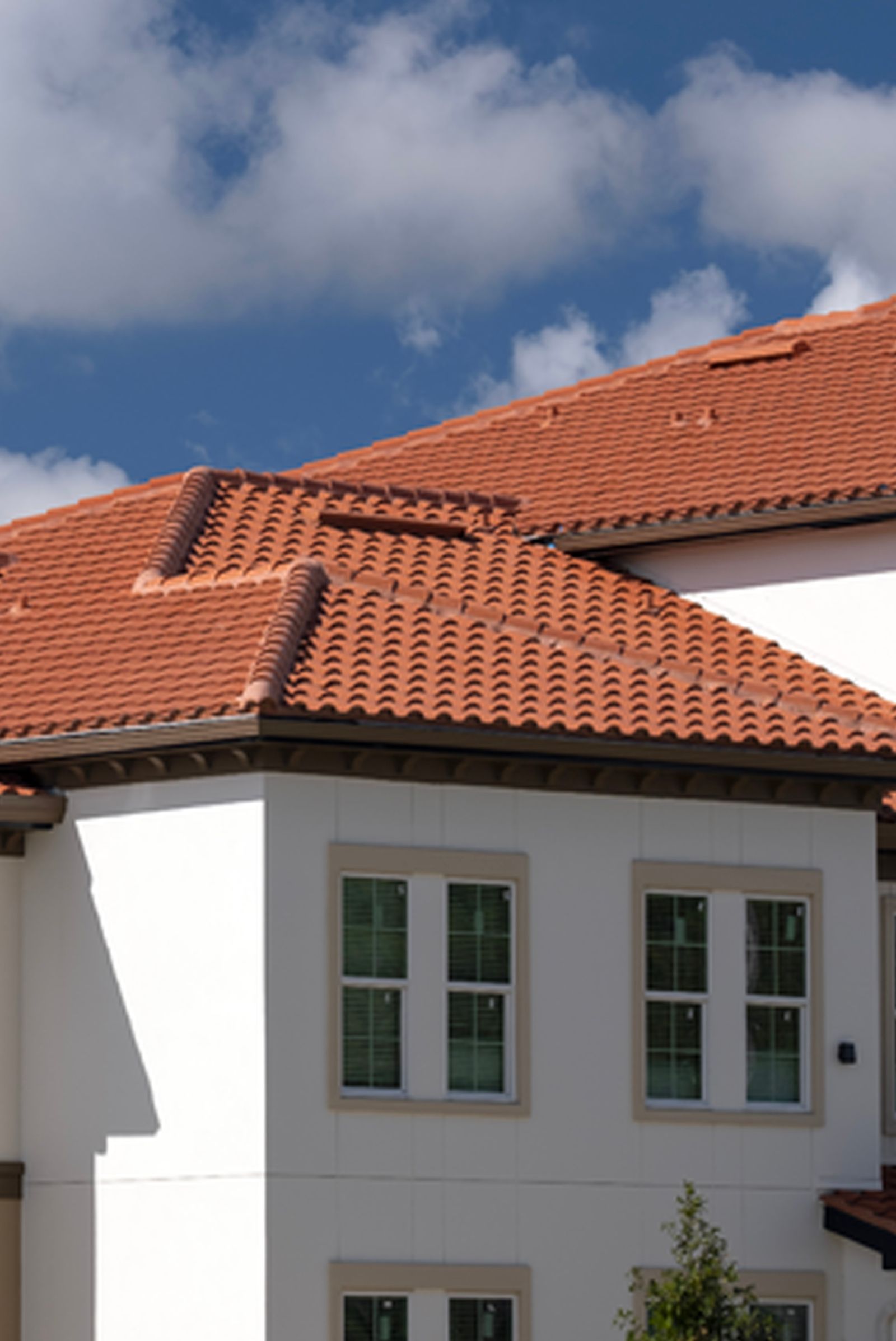 A group of people are working on the roof of a building.