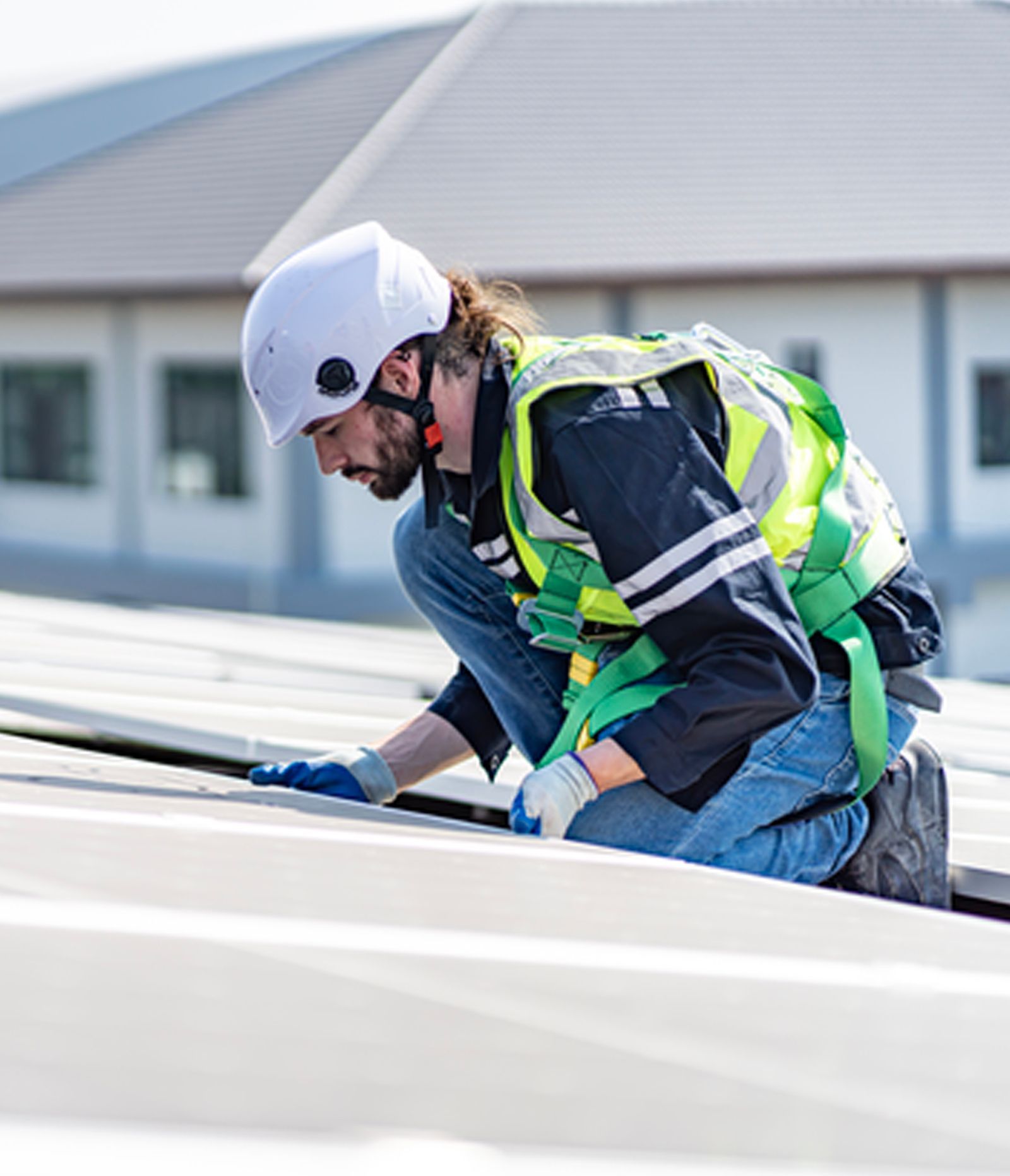 A group of people are working on the roof of a building.