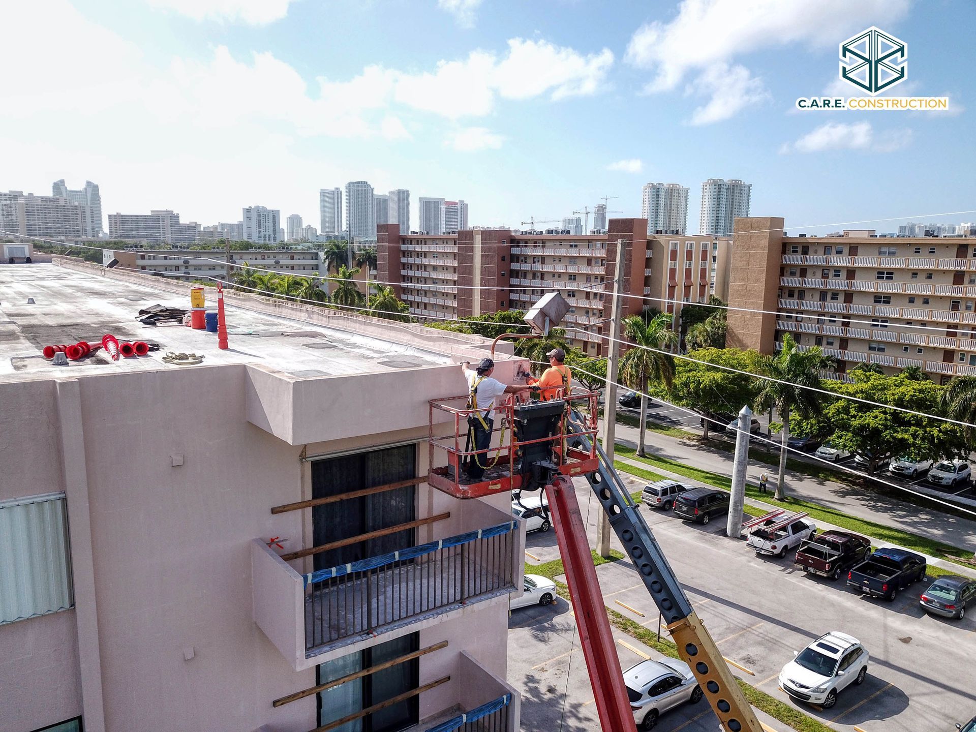 A group of people are working on the roof of a building.