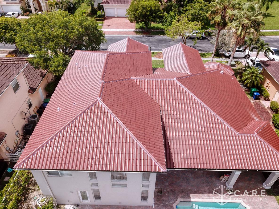 An aerial view of a house with a red tile roof.