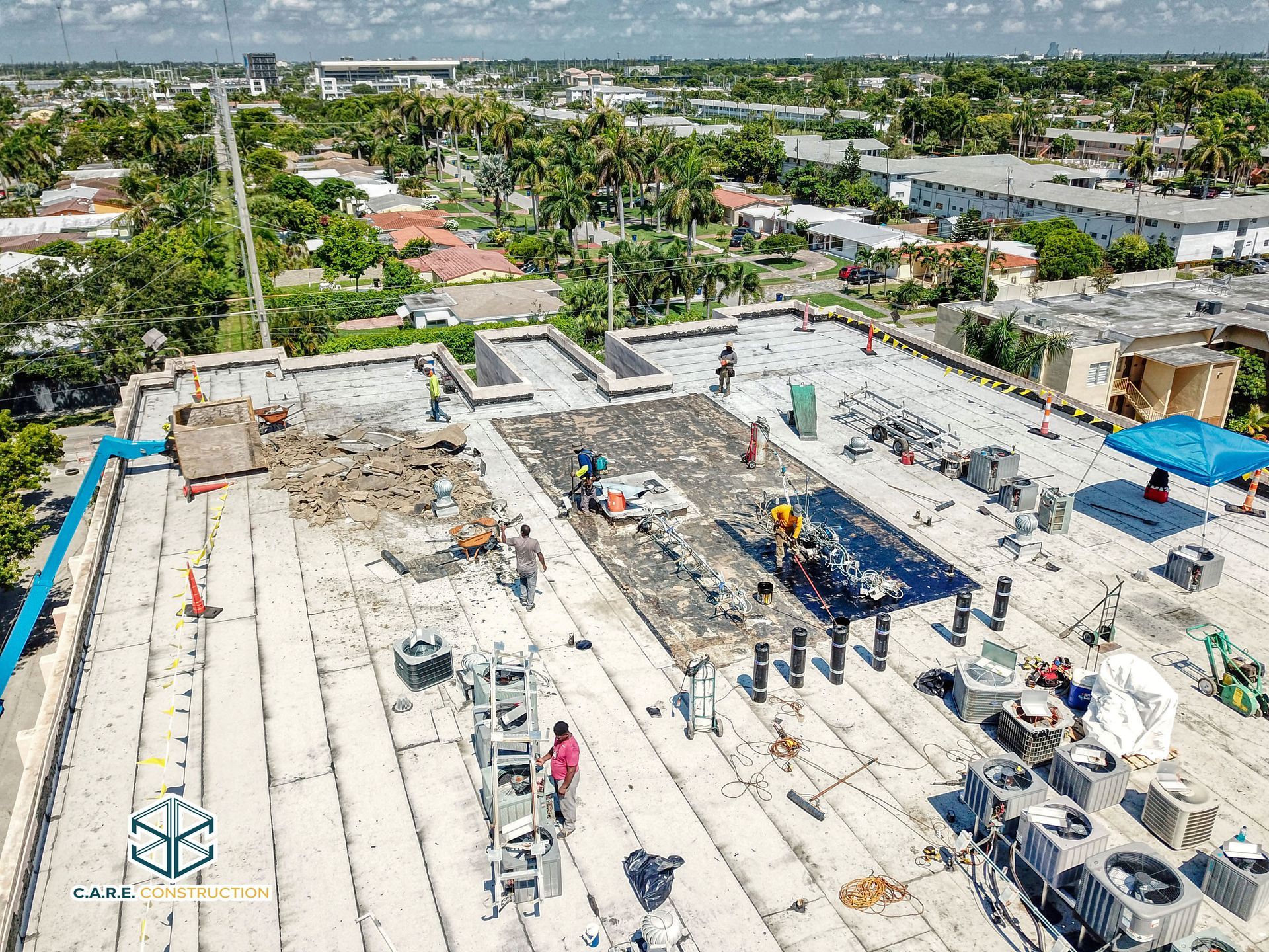An aerial view of a roof under construction in a city.