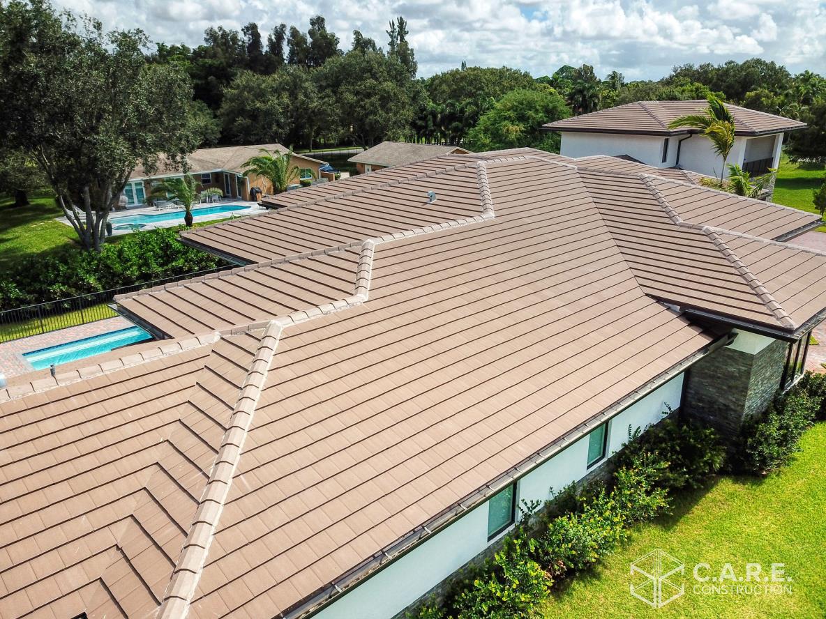 An aerial view of a house with a brown roof