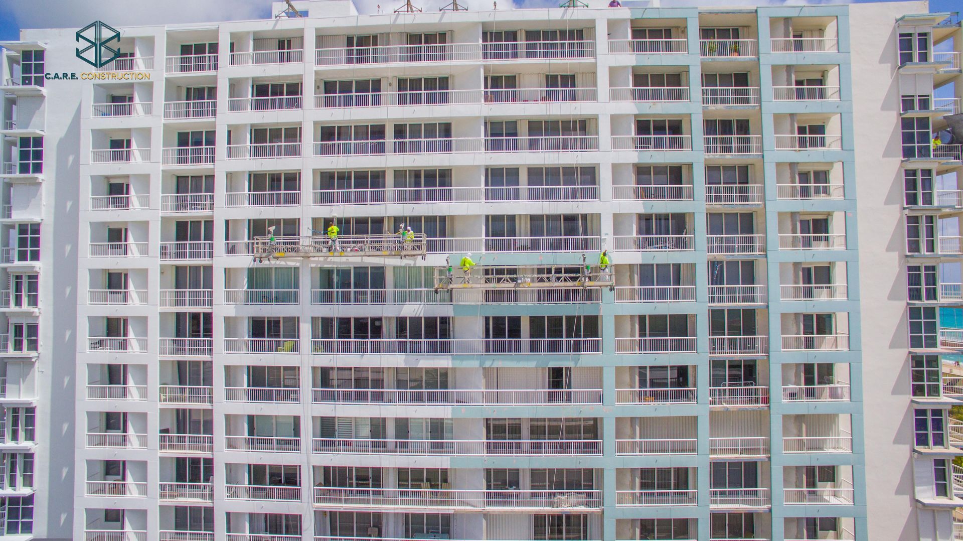 An aerial view of a large apartment building under construction.