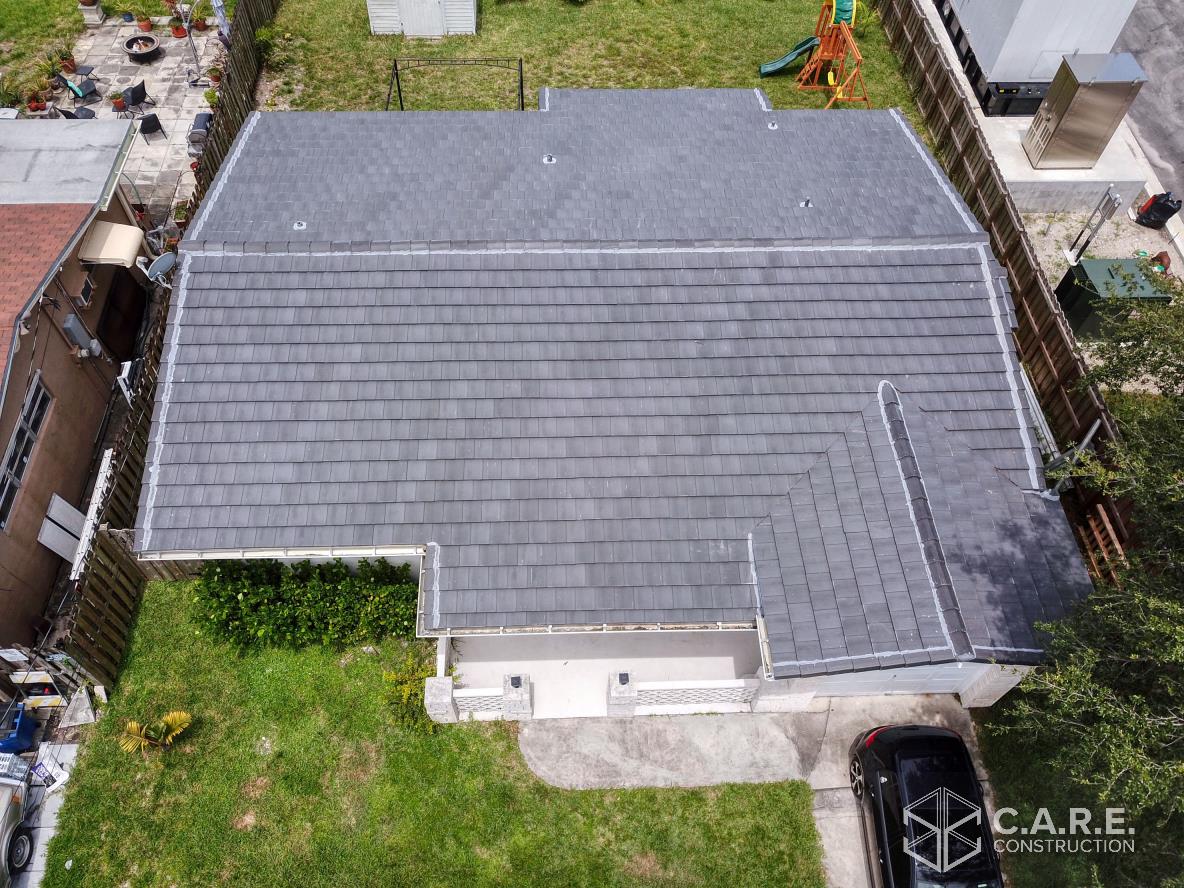 An aerial view of a house with a new roof.