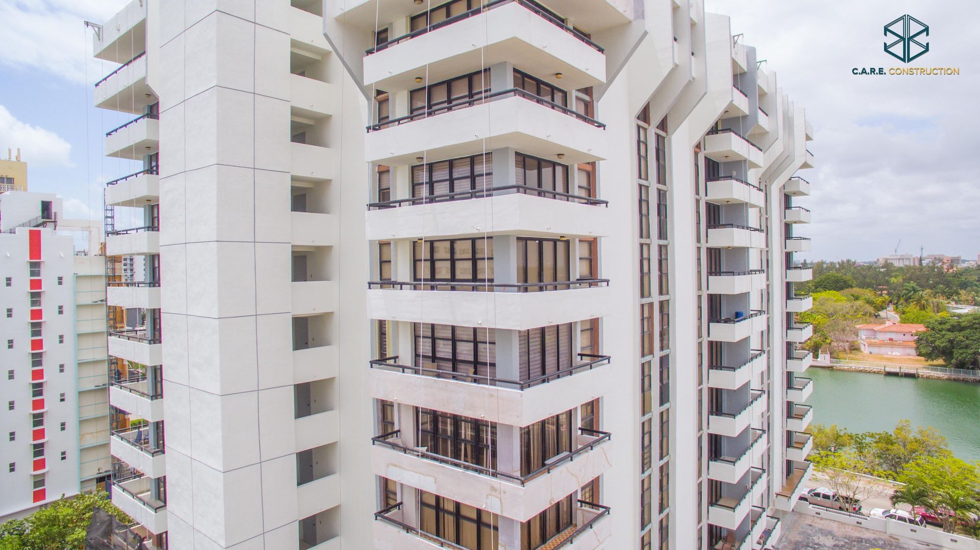 An aerial view of a tall building with lots of windows