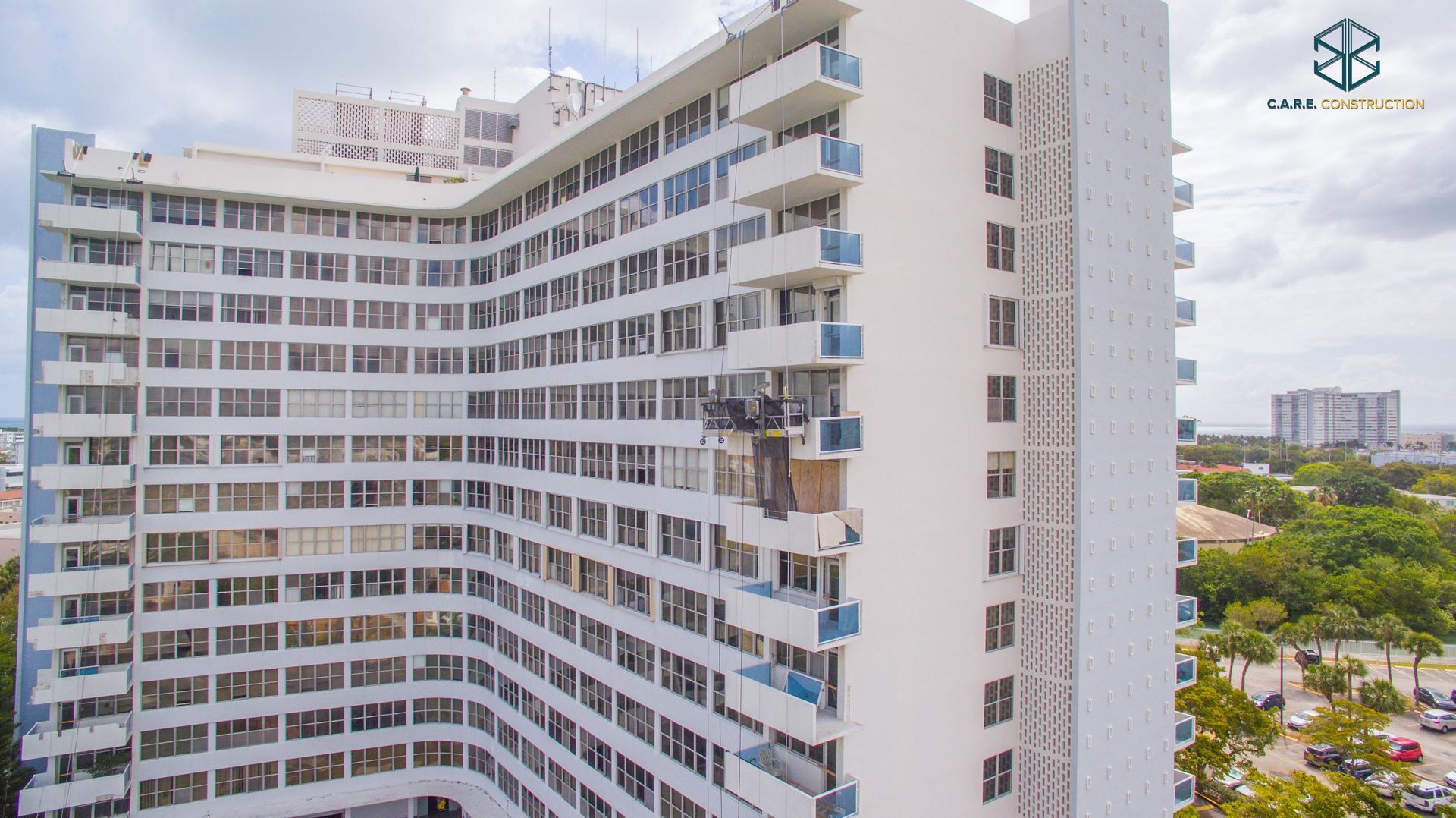 An aerial view of a large building with a lot of windows and balconies.