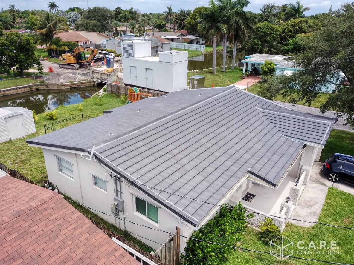 An aerial view of a house with a new roof.