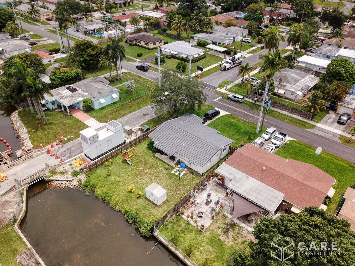 An aerial view of a residential area with lots of houses and trees.