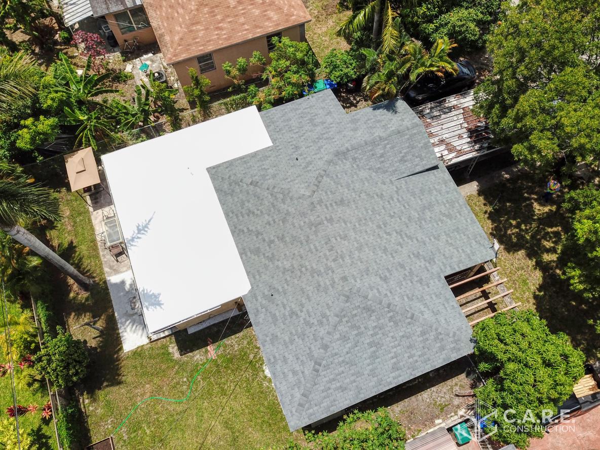 An aerial view of a house with a roof that has been installed.