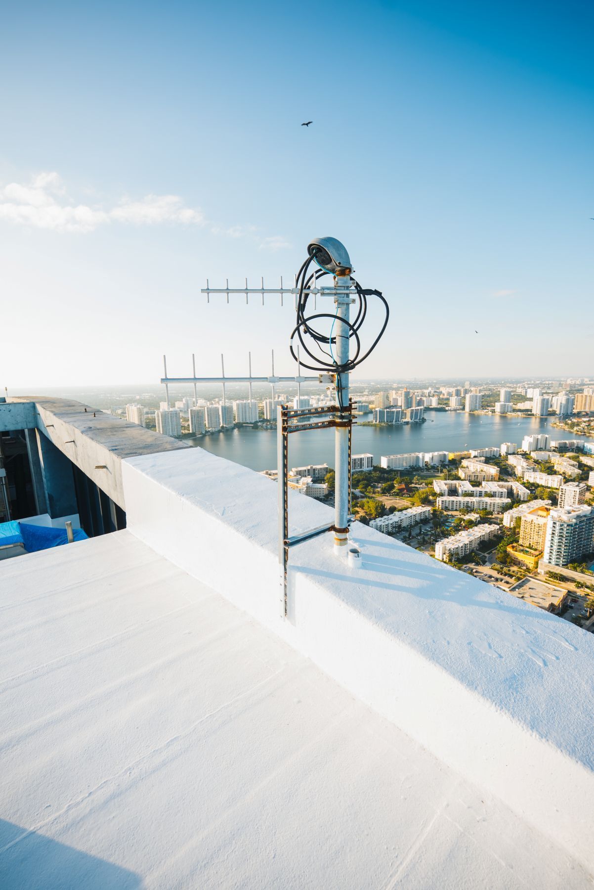 A group of people are working on the roof of a building.