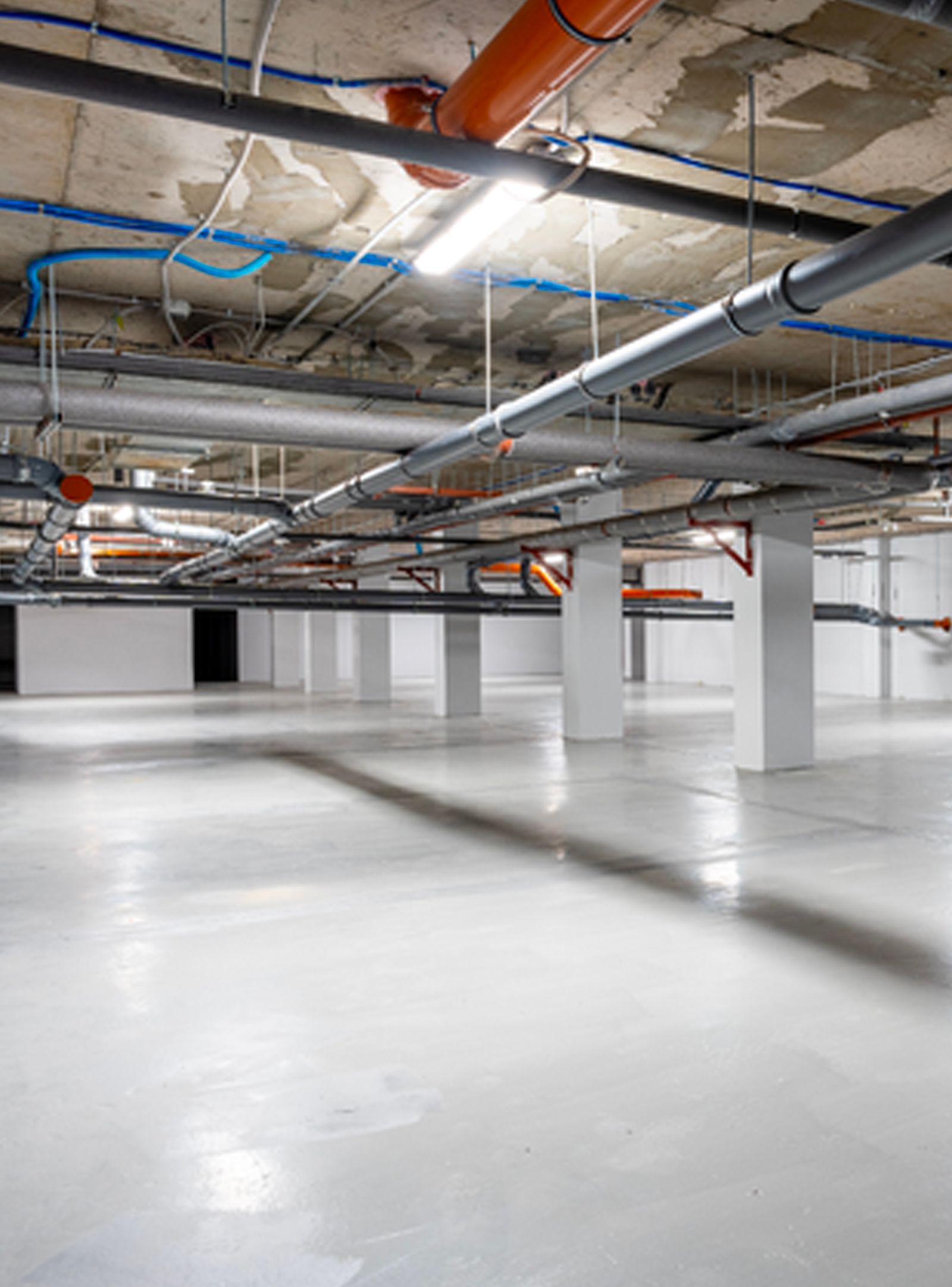 A group of people are working on the roof of a building.