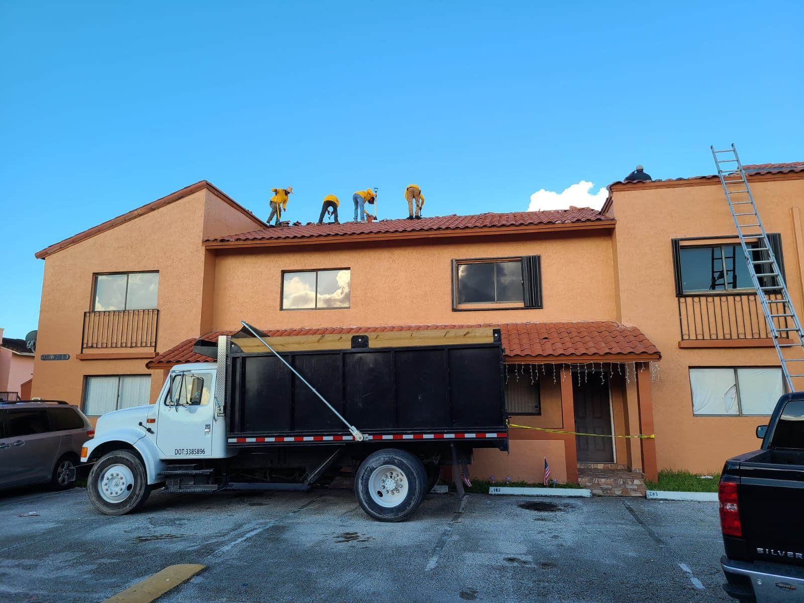 A dump truck is parked in front of a building