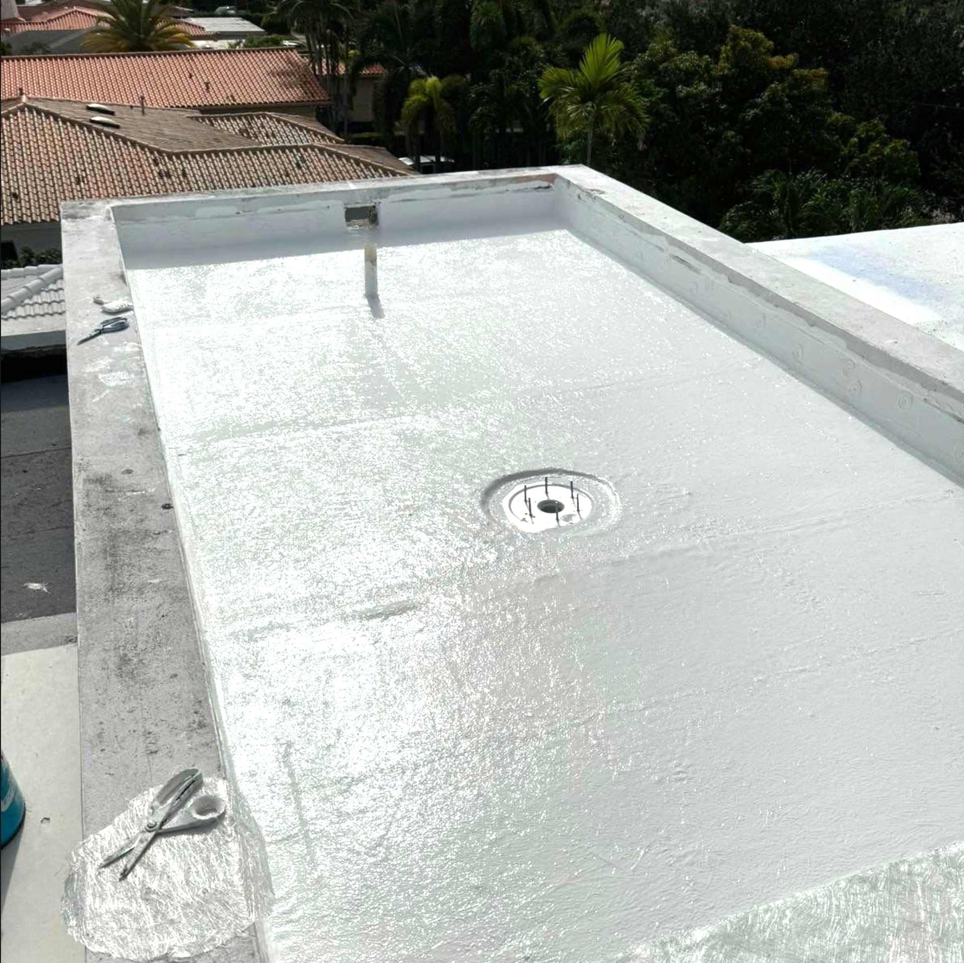 A white roof with a hole in the middle of it