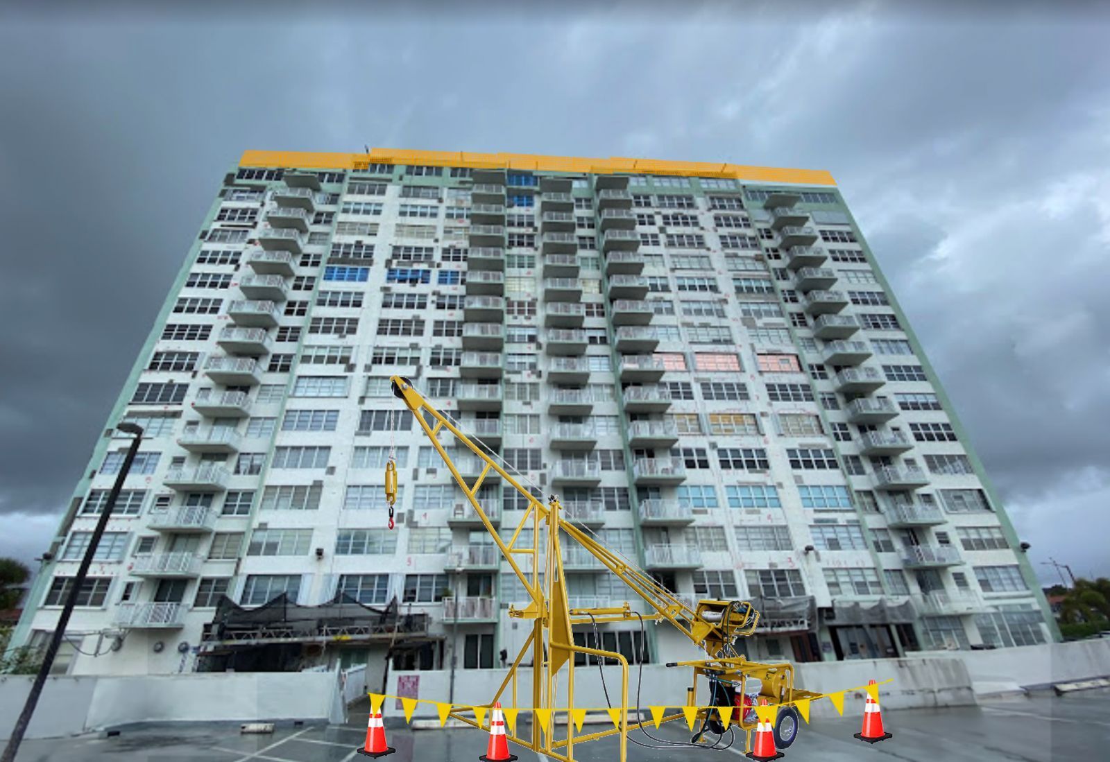A large building under construction with a crane in front of it.