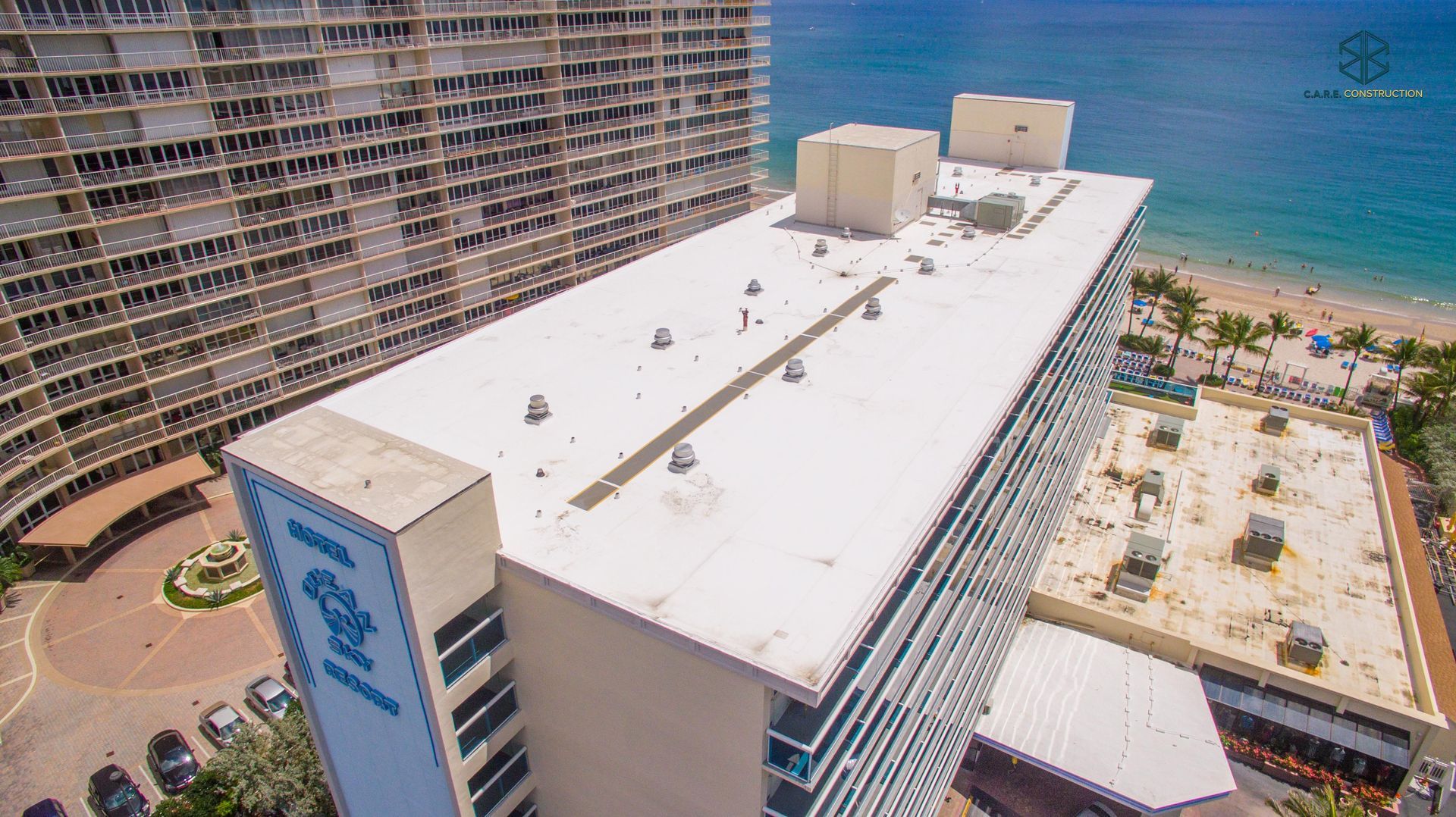 An aerial view of the roof of a hotel near the ocean