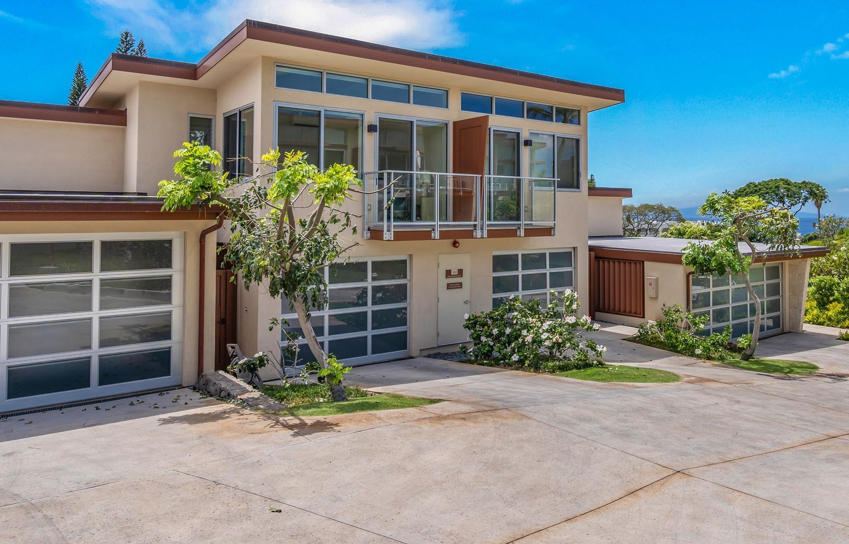 A beautifully maintained rental home in Hawaii with lush landscaping, showcasing expert property management by Coldwell Banker Property Management.