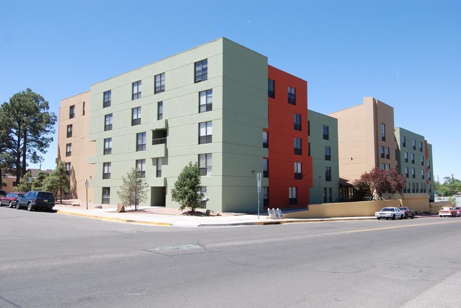 A large apartment building with a lot of windows