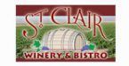 A winery and bistro logo with a barrel in the middle of a field.