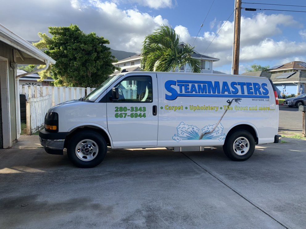 A white van with the word steammasters on it