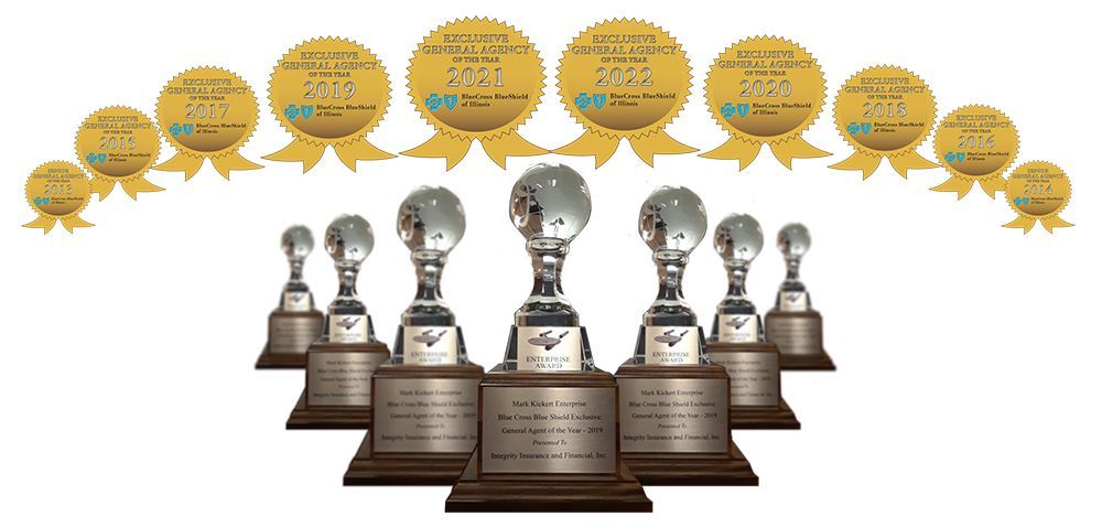 A group of trophies are lined up in a row on a white background.