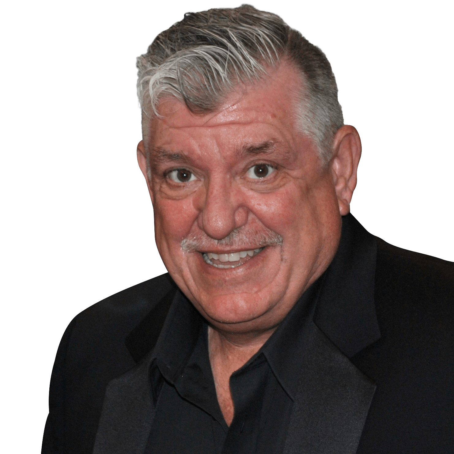 A man with gray hair and a mustache is smiling for the camera