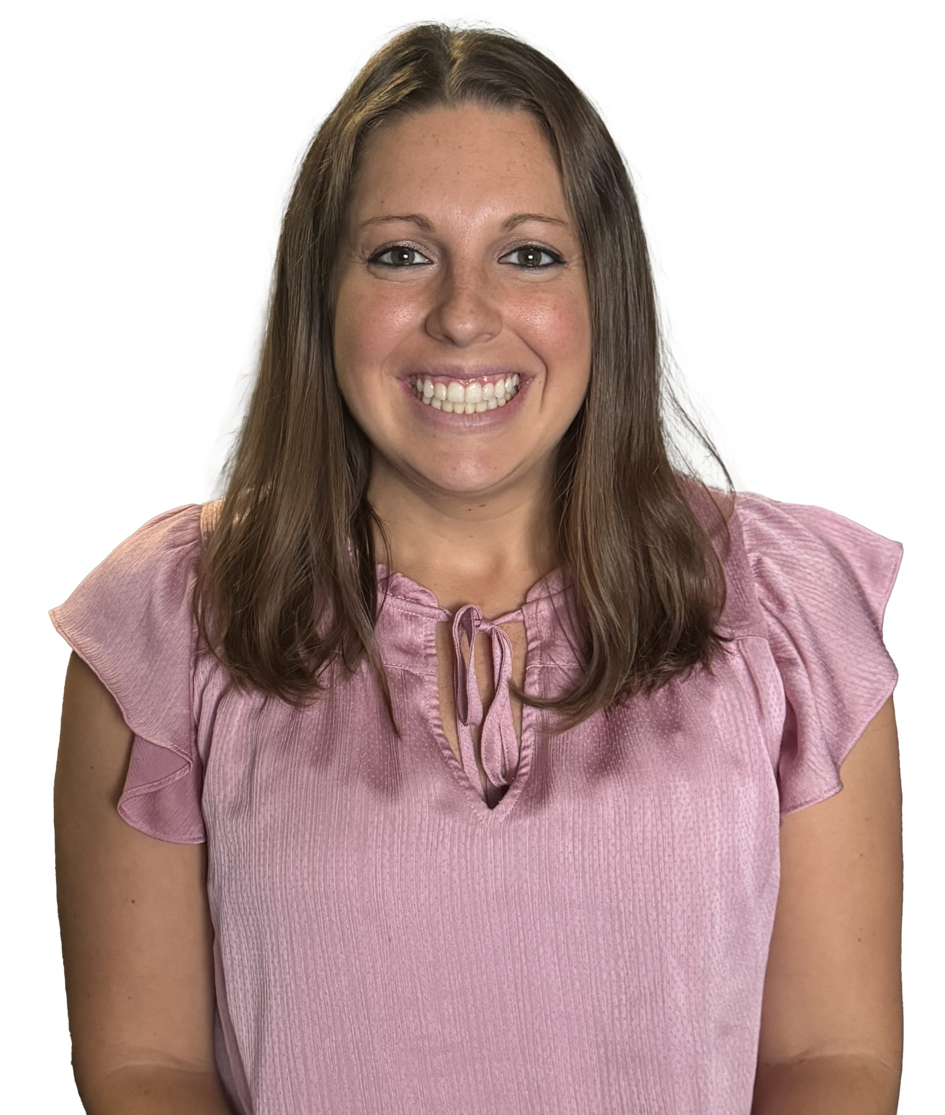 A woman in a pink shirt is smiling for the camera.